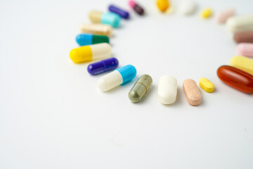 Clock made of pills capsules, pills form a circle, omega, vitamins, Cod liver oil, supplements
