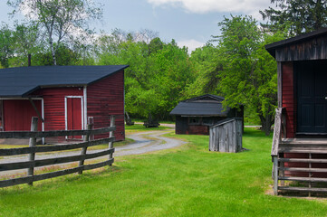 wooden buildings on a green lawn in eckley miners village in rural pennsylvania