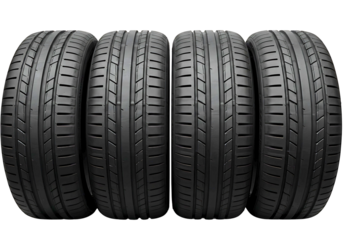 Four new car tires with detailed tread patterns isolated on transparent background