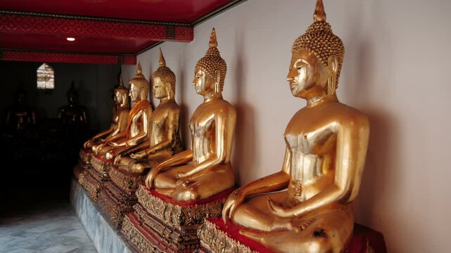 Golden buddha statues in wat pho temple, Bangkok, Thailand, showcasing spiritual harmony and rich cultural heritage of Bangkok landmarks.