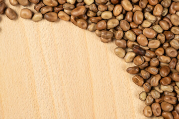 Whole dried raw uncooked vicia faba beans close-up
