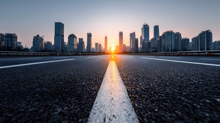Empty City Road Facing Downtown Skyline During Sunrise

