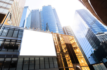 Blank billboard on office building wall