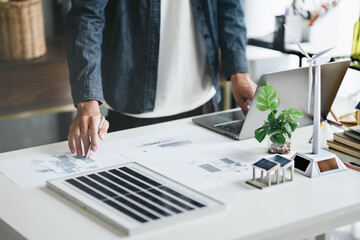 Business eco Alternative, sustainable electricity, people creating ideas working on green energy in...