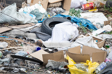 A chaotic scene of discarded waste showing the impact of pollution on the environment.