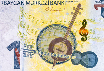 1 Manat Azerbaijan, with the image of Azerbaijani national musical instruments &ndash; Tar, Kamancha, and Daf. Money of Azerbaijan.