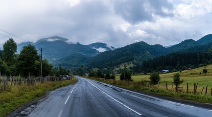 The road leads to the mountains, with tree-lined mountain roads, cloud-shrouded mountains in front of and behind, and damp asphalt pavement. Forest after rain with misty mountain background.