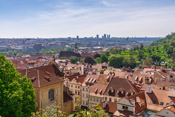 Scenic panoramic view over Prague city with red rooftops and historic landmarks
