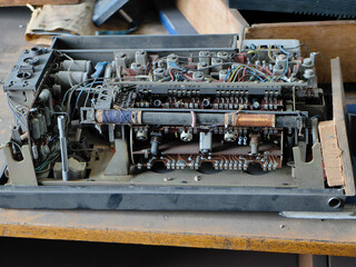 Detailed shot of an old radio, disassembled electronic device, showcasing intricate circuitry and...