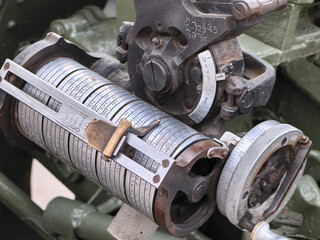 An intricate, detailed view of an old  soviet artillery gun sight showcasing its precise mechanism.