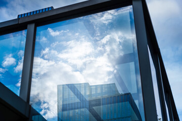 Modern office building reflection on window glass