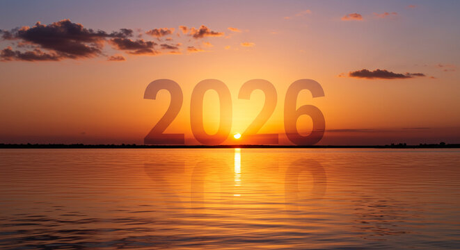 Anticipating the future year 2026 displayed over a serene water landscape at golden hour