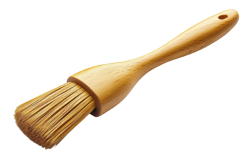 A craftsman s wooden pastry brush ready to glaze homemade delicacies offering a touch of on transparent background