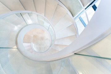 Beautiful white spiral staircase in the building