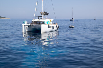 Catamaran Anchored in Calm Blue Sea