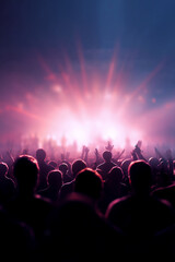 Obraz premium A crowd silhouette at a concert or event with hands raised, illuminated by bright, colorful stage lights