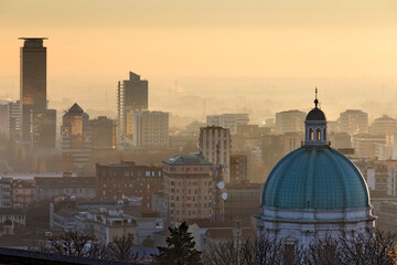 Brescia: the dome of the cathedral of Santa Maria Assunta. On the left, the Symbol tower and the Mercurio palace. Lombardy, Italy.