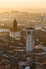 The Pallata Tower and the bell tower of the church of San Giovanni Evangelista. Brescia, Lombardy, Italy.
