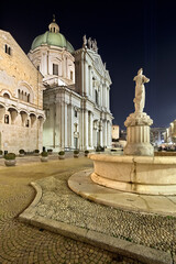 Brescia: the Cathedral of Santa Maria Assunta and the Broletto Palace in Paolo VI Square. Lombardy, Italy.