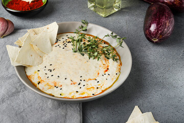 Baba Ganoush with Microgreens and Flatbread on Stone Background