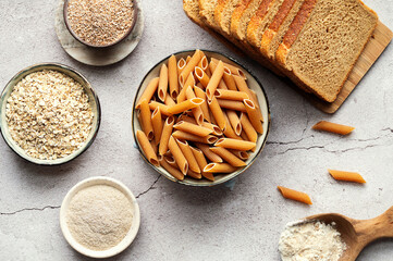 High-fiber foods, including wholegrain pasta, organic oats, and whole wheat flour and bread.