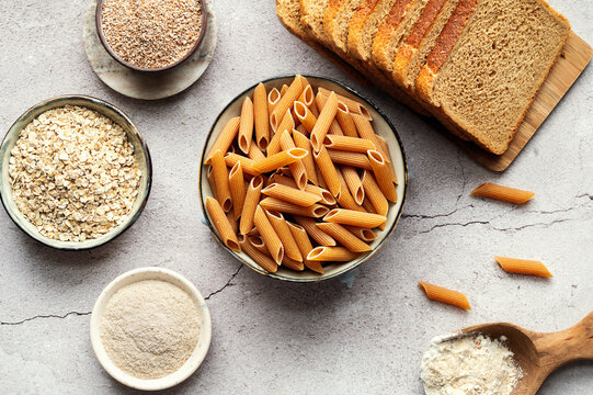 High-fiber foods, including wholegrain pasta, organic oats, and whole wheat flour and bread.