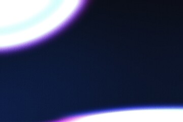Vivid blue and purple light leak with a subtle grain effect on a dark background, perfect for adding a vintage or futuristic aesthetic to your designs