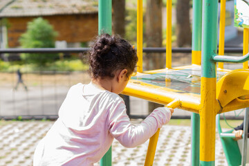 Daughter playing in backyard playground