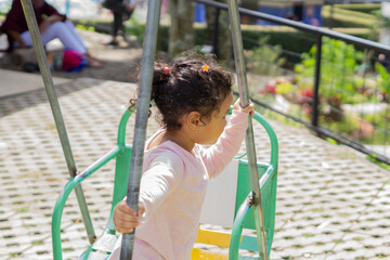 Daughter playing in backyard playground