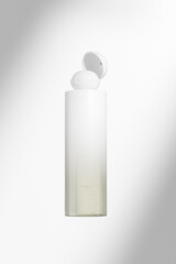 luxury cylindrical shape cosmetic bottle with spherical flip Cap mockup, round skincare lotion container with fade gradient finish, cylinder squeeze bottle with flip cap liquid shampoo packagings