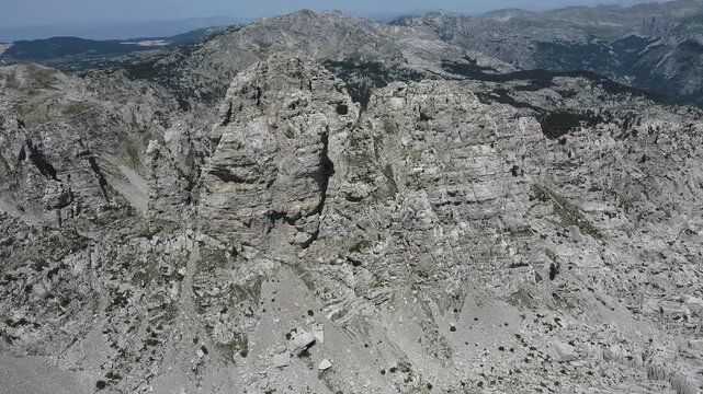 Aerial view of the sharp cliffs and peak of Babin Zub mountain in the Maganik mountain range in Montenegro.