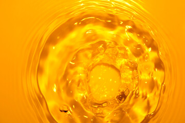The surface of the water splashes orange.