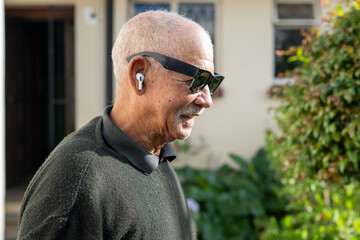 Side view of man with sunglasses and pods