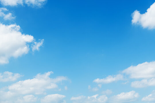 Background of blue sky with some white clouds