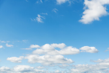Fototapeta premium Background of blue sky with some white clouds