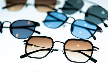 Many sunglasses are displayed in the store