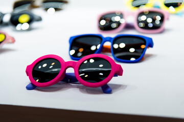 Kids sunglasses are displayed in the store