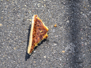 Pizza Slice on Asphalt