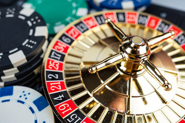 Action shot of a spinning golden roulette wheel in a casino, highlighting the dynamic motion and...