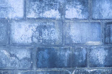 Ancient brick wall in vintage blue.