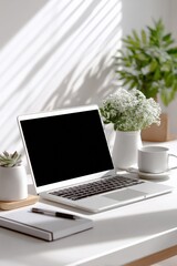 Fototapeta premium Modern minimalist workspace with open laptop on clean desk illuminated by natural sunlight, with potted plants and coffee mug for productivity