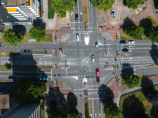 Aerial view of a sunny intersection in Eindhoven, Netherlands, featuring cars, bicycles,...