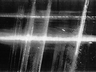 Naklejka premium Old film texture with scratches, noise and glitch shapes. Realistic overlay film texture in black-white, dust and grain. 