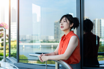 Fototapeta premium Businesswoman looking away on the balcony