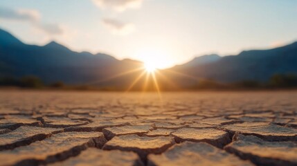 Beach made of cracked dry earth, striking symbol of climate extremes and environmental contrast