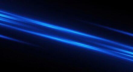 Dynamic blue light streaks across a dark background, creating an abstract, energetic visual effect.
