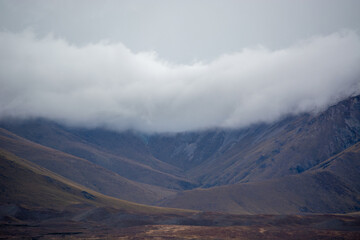 Misty Mountains Under Cloudy Skies