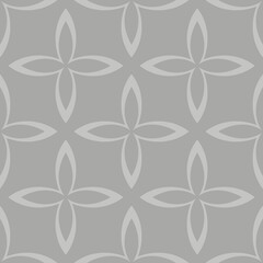 A symmetrical pattern features petal-like shapes arranged in a grid against a gray background. The repetitive design creates a harmonious and balanced visual effect.