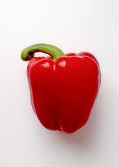 Fresh sweet red bell pepper on white background.