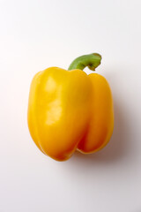 Fresh sweet yellow bell pepper on white background.